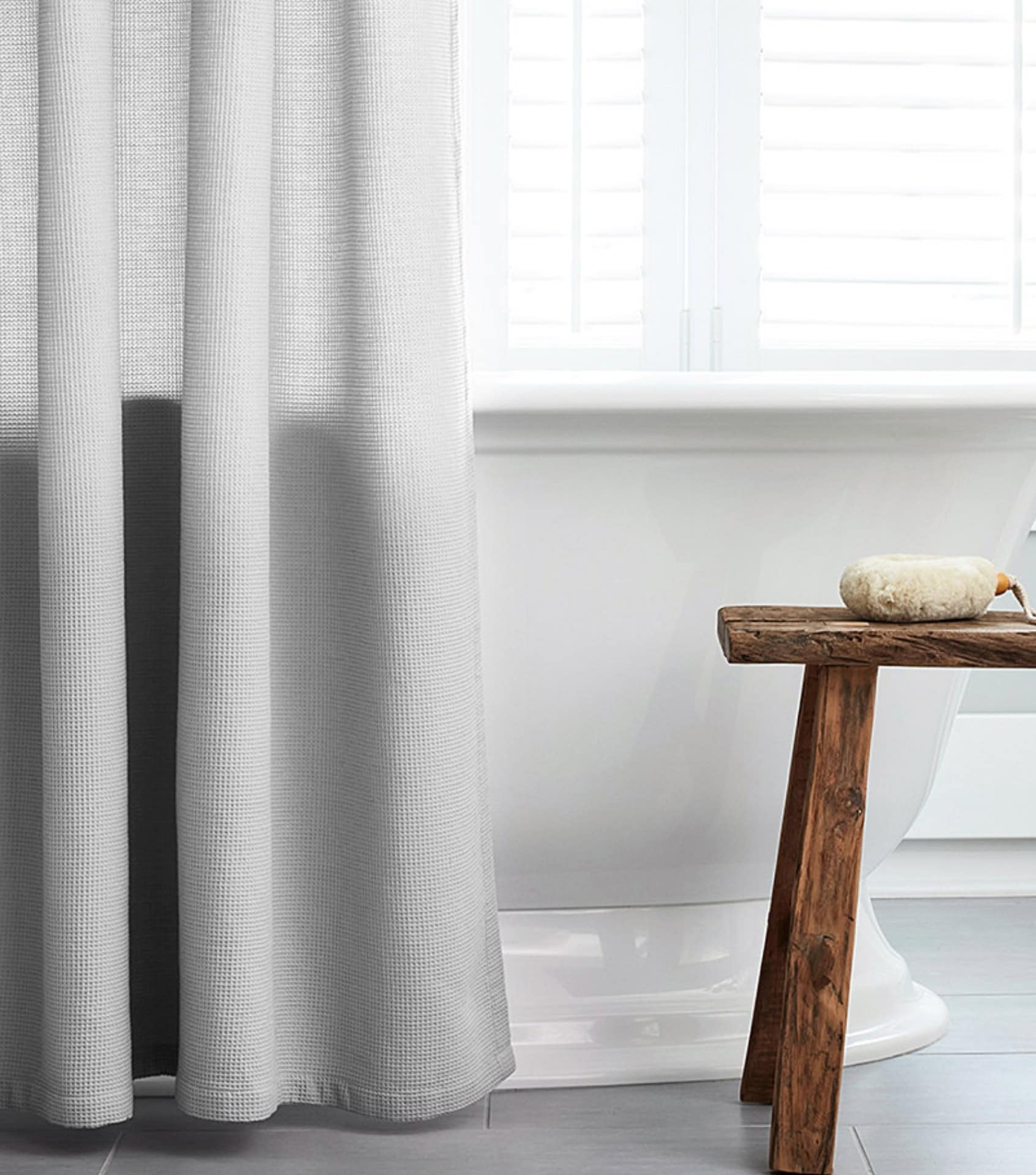 Image by Boll & Branch (eco-friendly-shower-curtains)